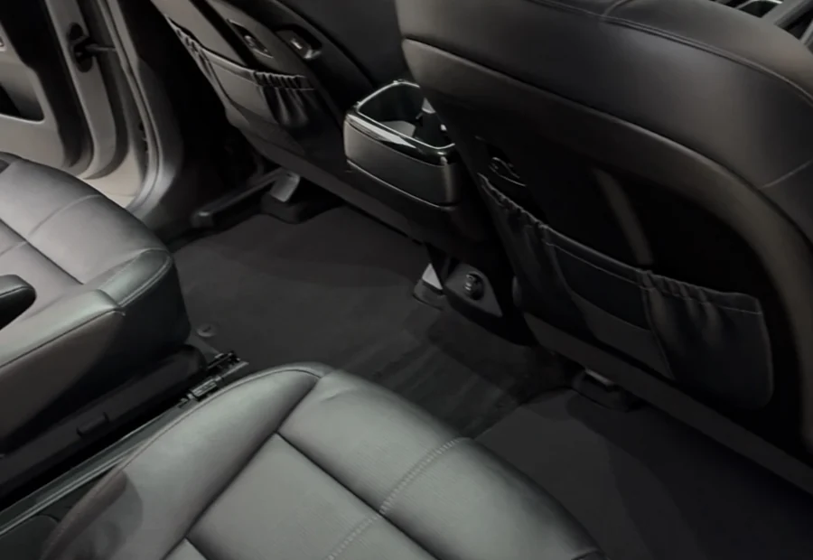 Freshly detailed black leather vehicle interior by Echelon