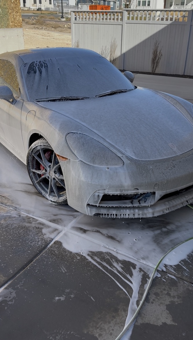 Luxury sports car covered in foam during an Echelon exterior detail